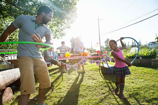 father and daughter hula hooping
